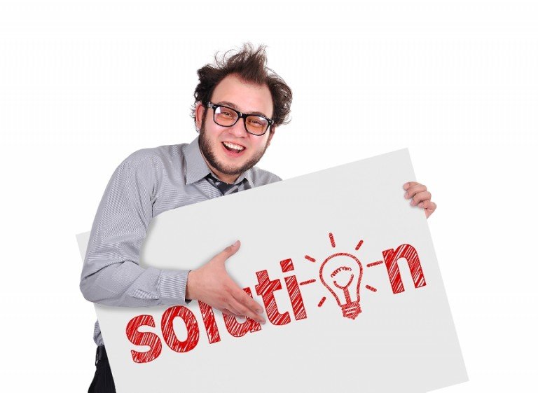 A guy holding a sign that says "Solution"