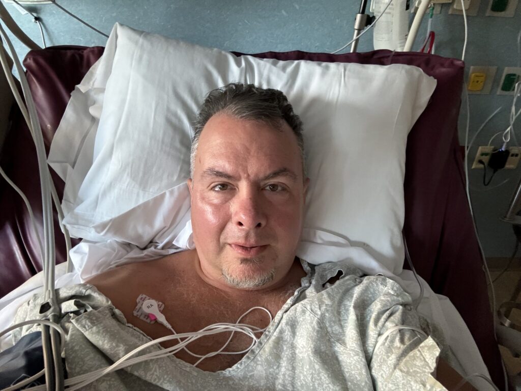 Me in the hospital bed, post-surgery